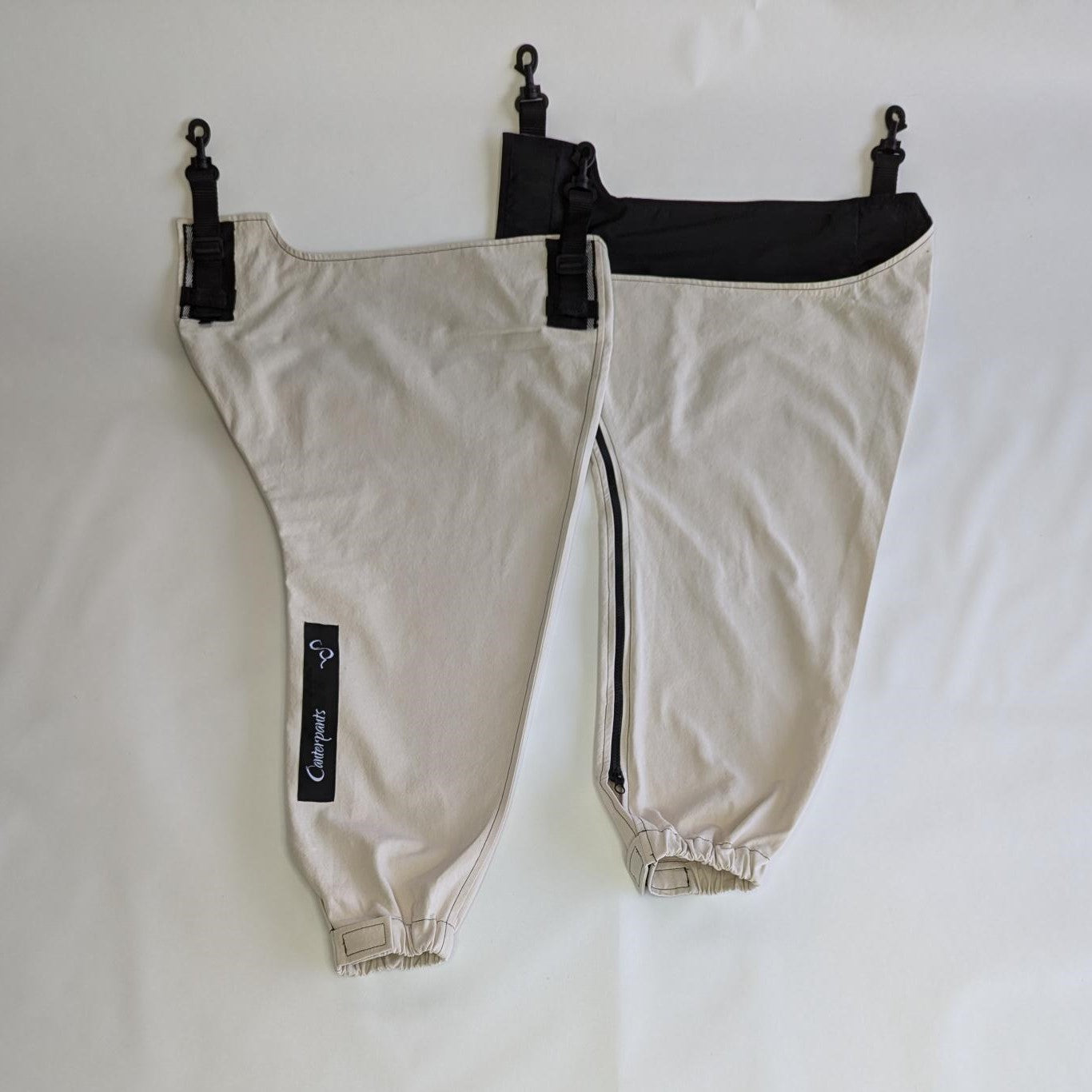 Small pair of beach coloured front leg Canterpants on white background